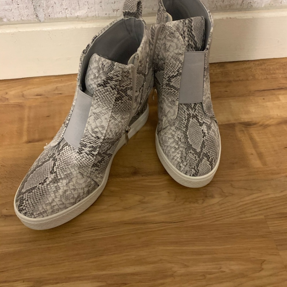 Boutique snakeskin wedges.